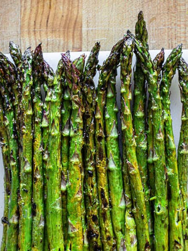 Asparagus should be tender-crisp after 12-15 minutes in a preheated 425°F (220°C) oven.