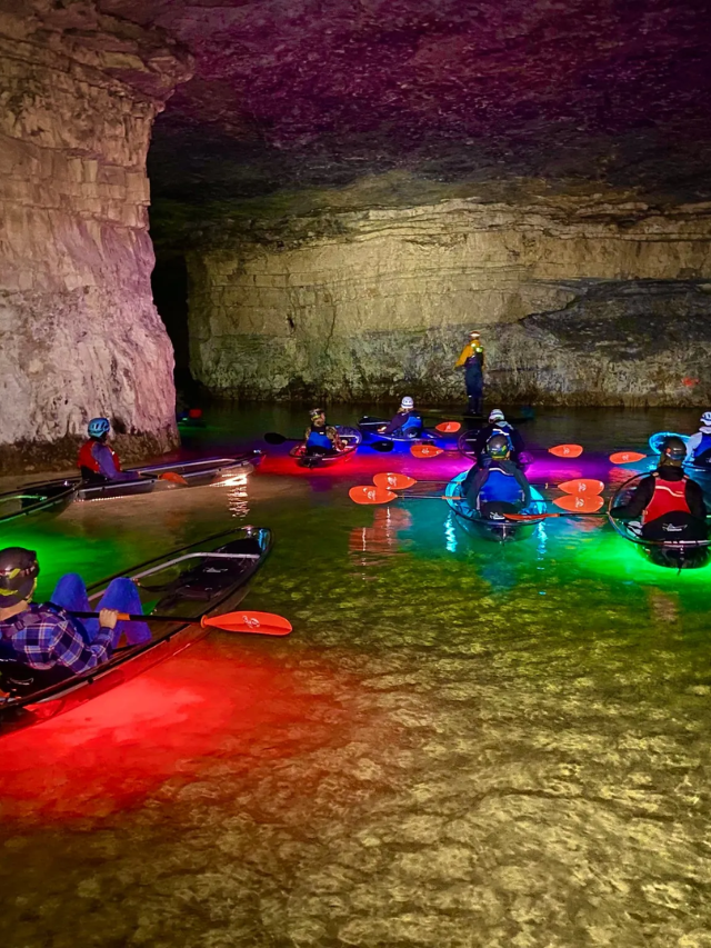 A person marveling at the intricate crystal formations within Crystal Cave.
