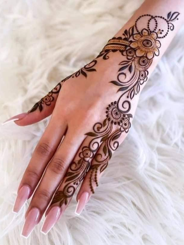 Geometric patterns like triangles and dots create a visually striking mehndi design. This design is perfect for weddings, festivals, or any occasion where you want a unique and eye-catching look.