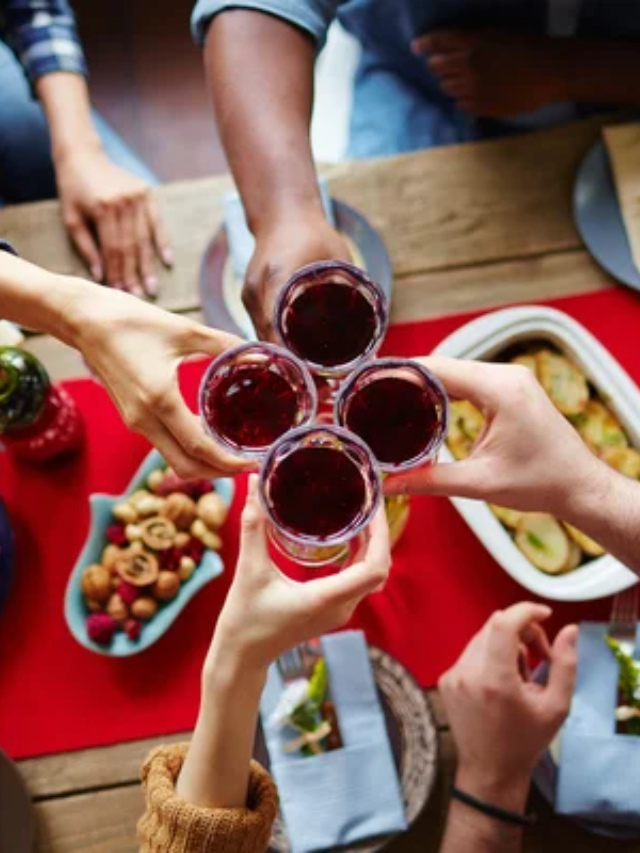 A happy family gathered around a dinner table, enjoying a healthy and colorful meal.
