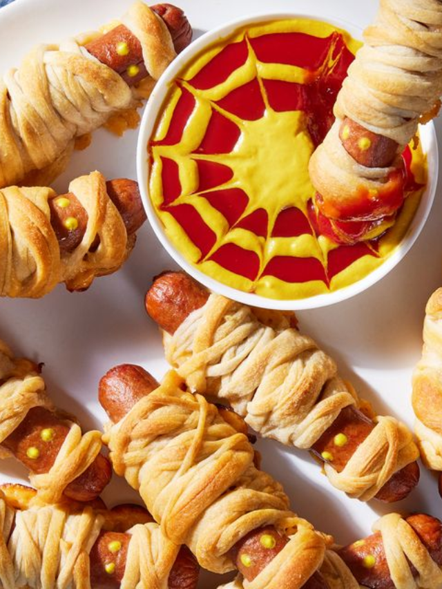 A cookbook open to a Halloween recipe with a spooky image.
