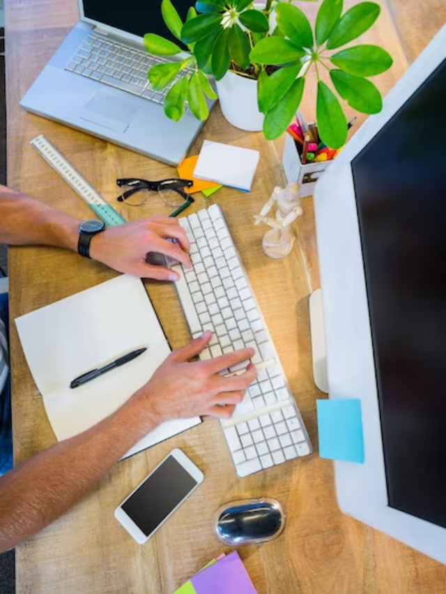 A person surrounded by question marks, frantically typing on a keyboard.
