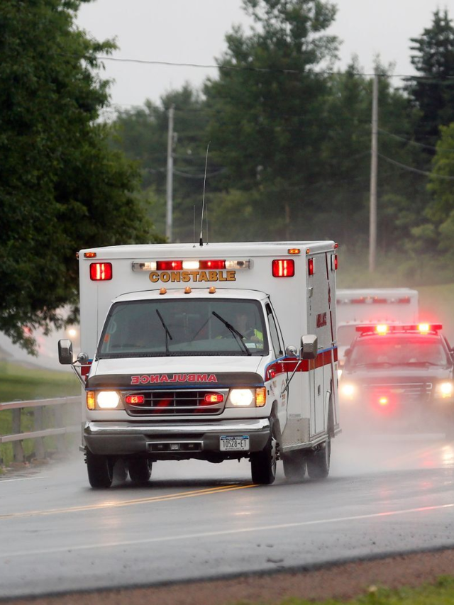 AMR Safety Team vehicle speeding onto the racetrack with caution lights flashing.
