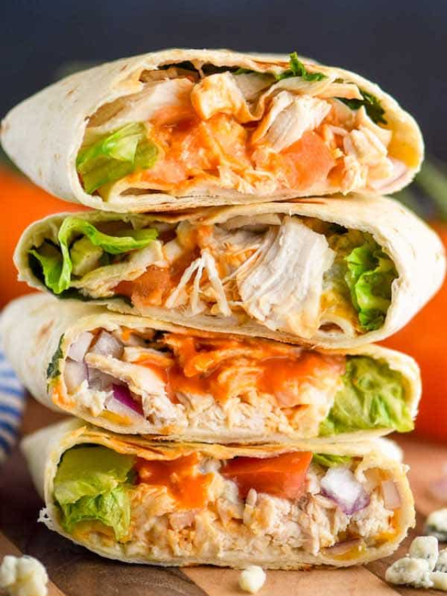 Buffalo Chicken Wraps with blue cheese crumbles and celery sticks
