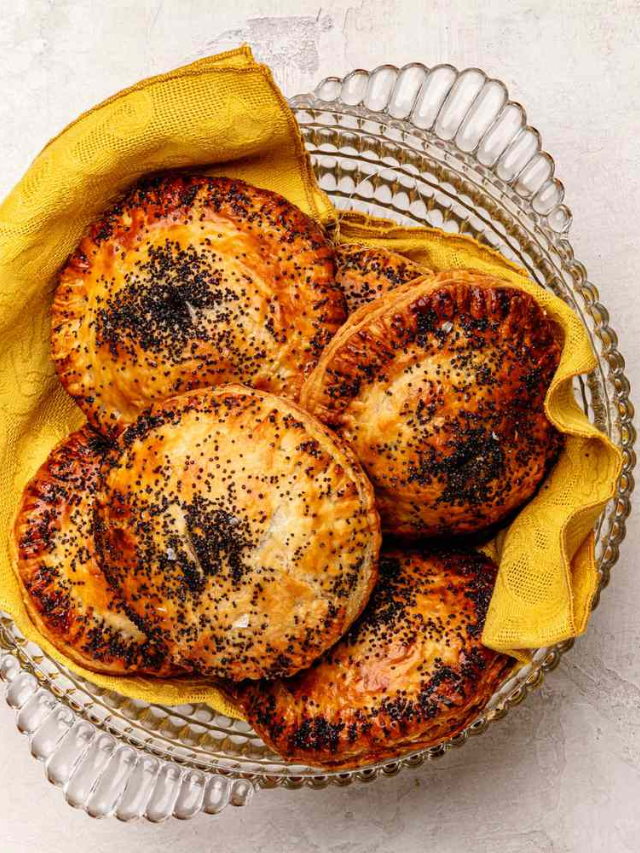  Golden brown hand pies filled with a mixture of Brussels sprouts, sweet potatoes, and savory herbs.

