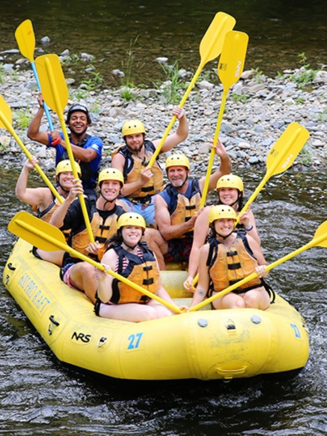 People enjoying whitewater rafting on the Delaware River.

