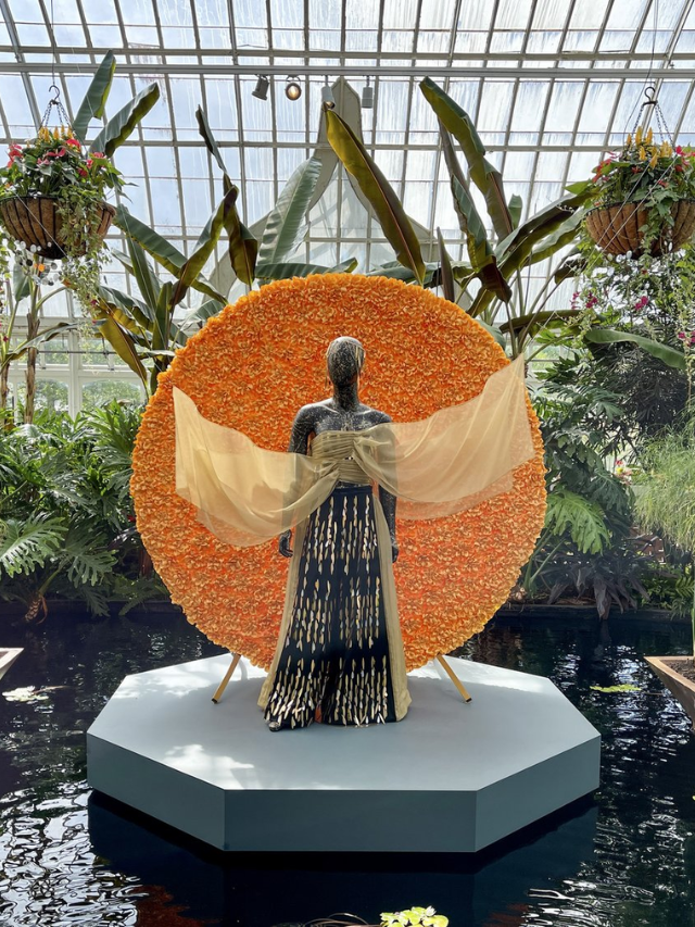  A serene photo of Phipps Conservatory and Botanical Gardens showcasing lush greenery and vibrant flowers.
