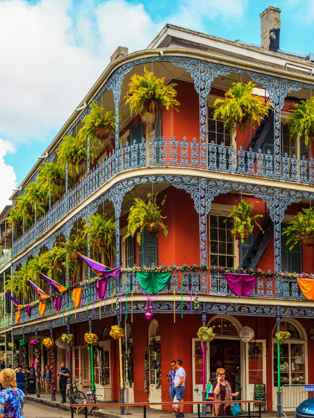 A photo of the charming streets of Mobile's French Quarter, lined with colorful buildings and wrought-iron balconies.
