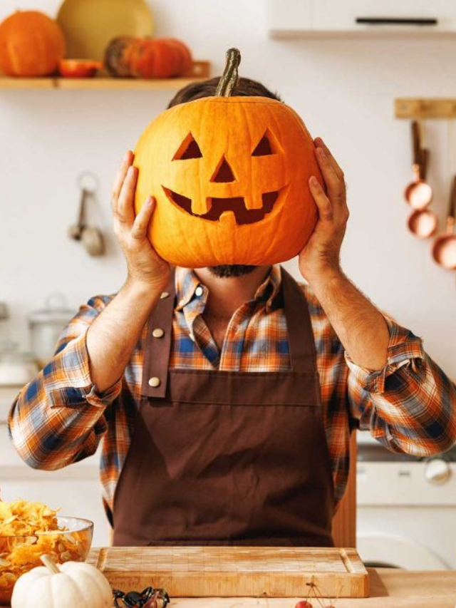 A family gathered around a Halloween table, laughing and enjoying their spooky feast.
