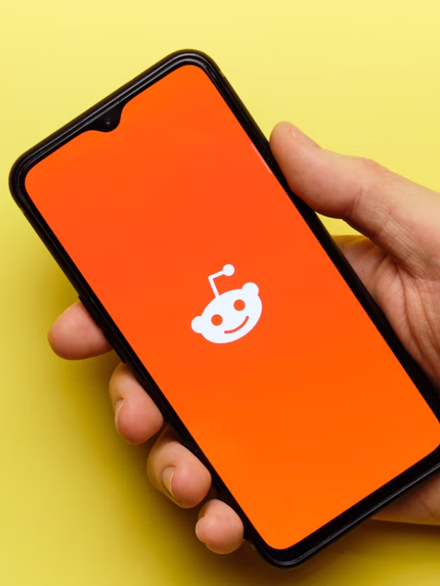 A person happily scrolling through Reddit on their phone.
