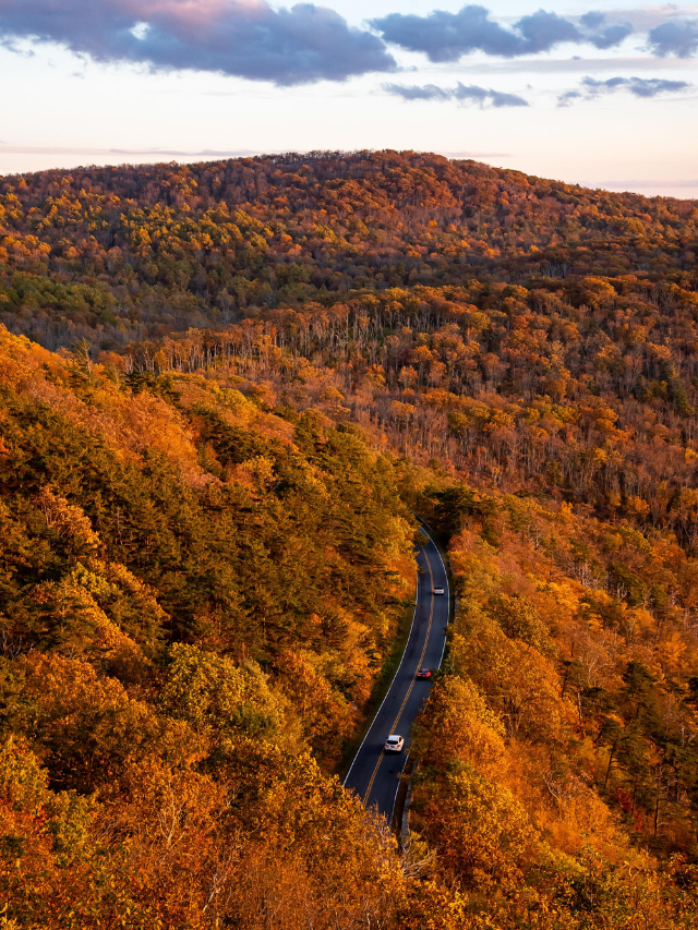 A breathtaking sunset over the Morgantown skyline, with mountains bathed in golden hues.
