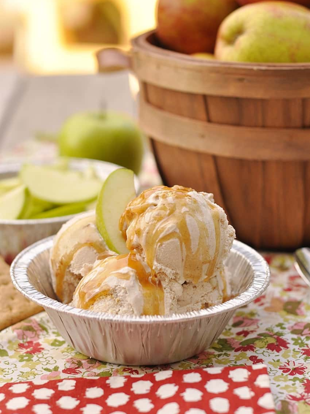  A warm apple crisp with a scoop of vanilla ice cream melting on top.
