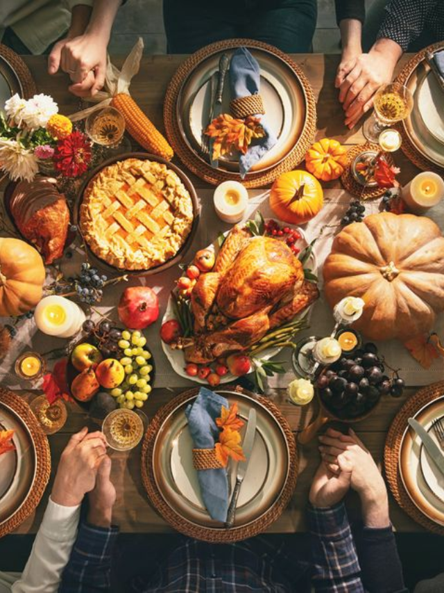 A family gathered around a dinner table, smiling and enjoying their meal
