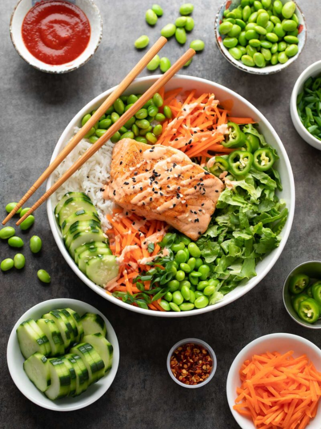A salmon power bowl with brown rice, roasted vegetables, and a lemon vinaigrette.
