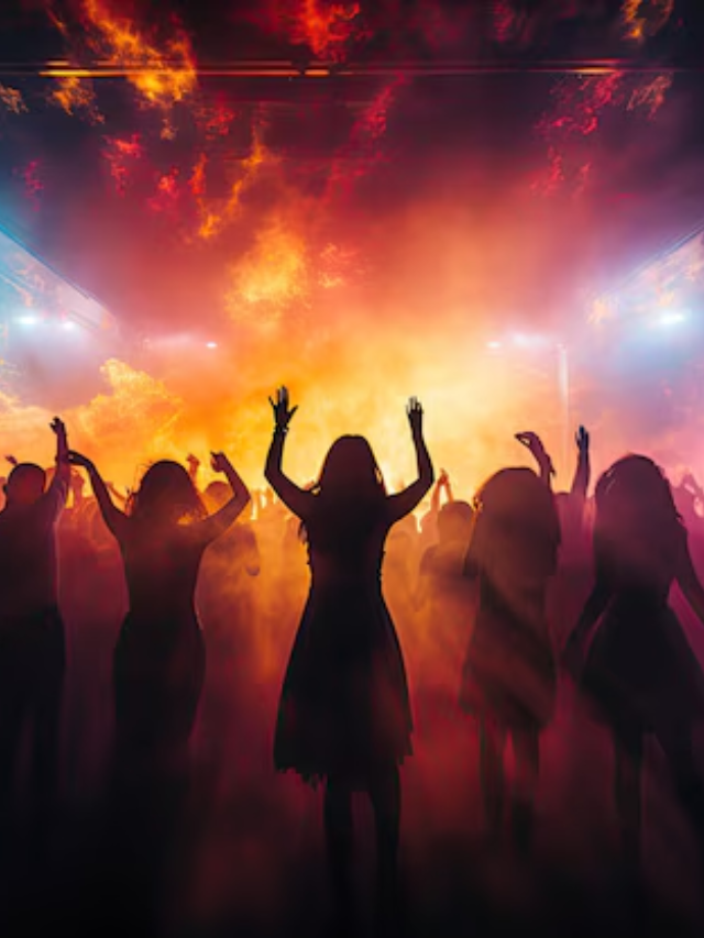 Live music performance at a vibrant outdoor venue with people dancing and enjoying the atmosphere.
