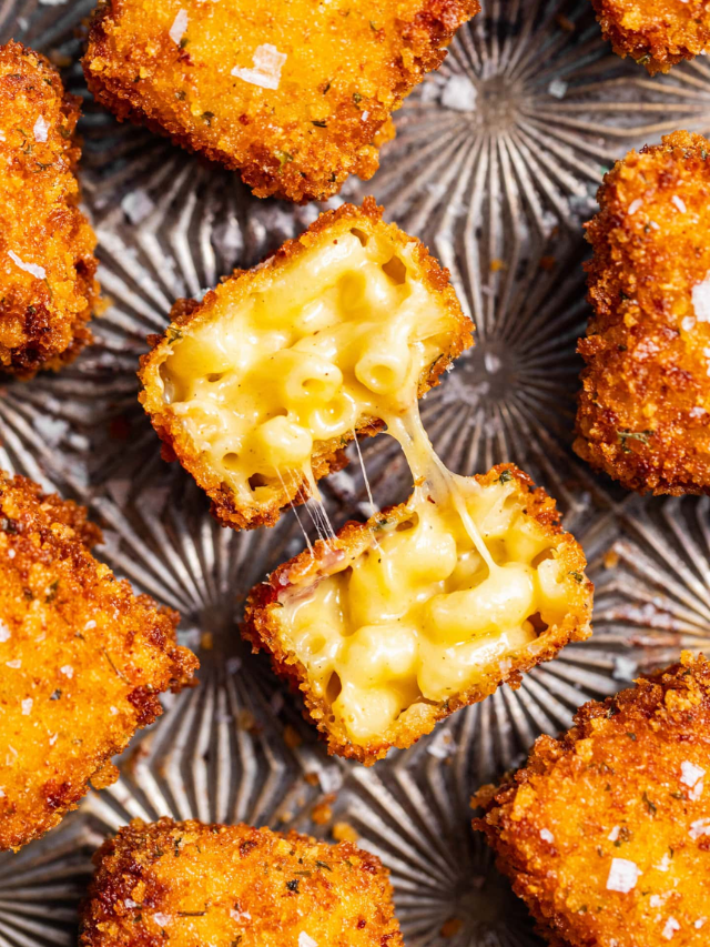 A bubbling dish of baked mac and cheese with a golden brown crust.
