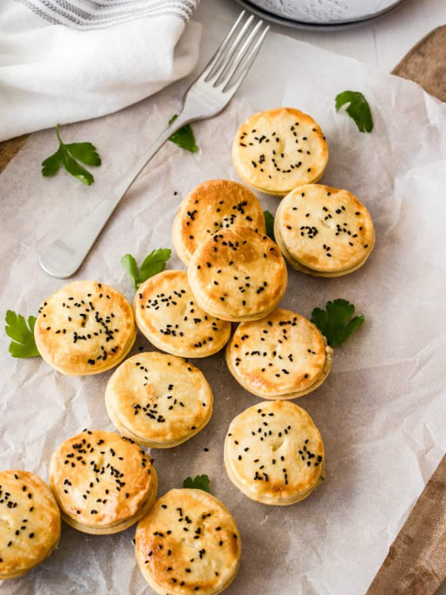 A photo of a chicken pot pie casserole with a golden puff pastry topping.
