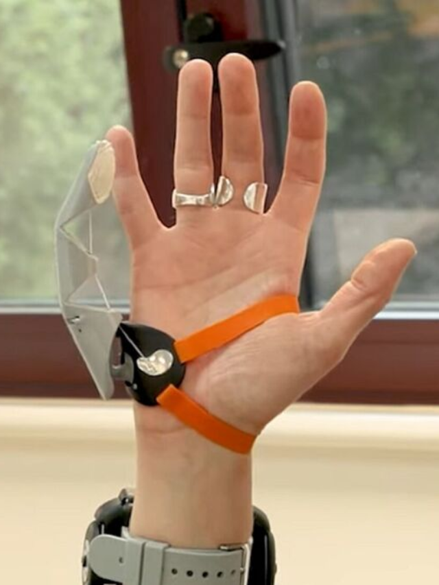 Photos of people using the Third Thumb at the exhibition.
