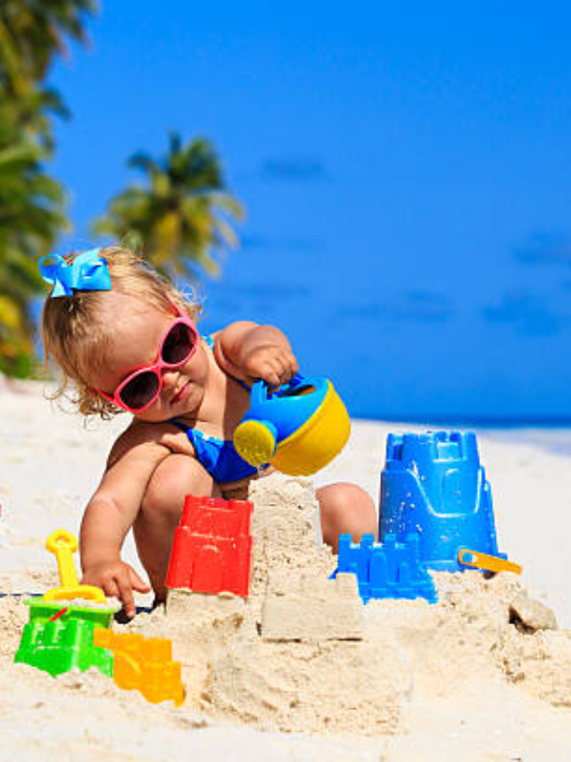  A family building a sandcastle on the beach, laughing and playing together.
