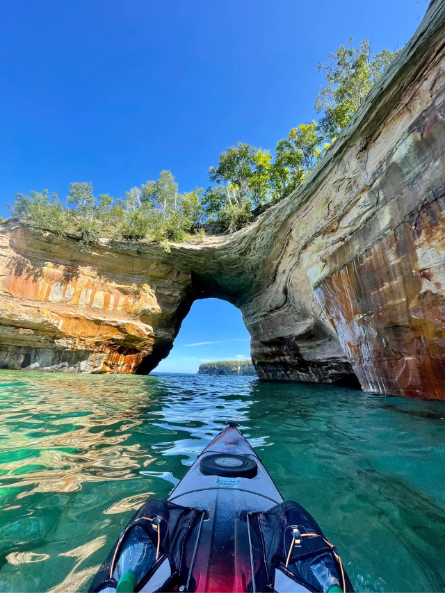 A collage of activities like kayaking, sailing, snorkeling, and stargazing.
