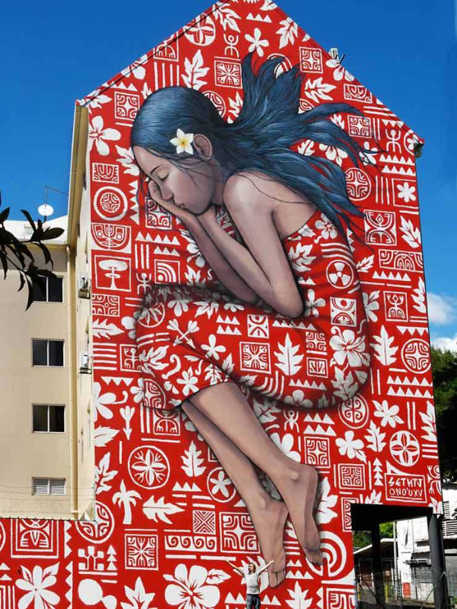 A close-up photo of a vibrant mural on a building wall.
