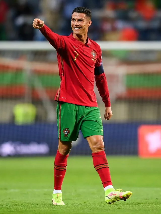 A montage of Ronaldo's career moments (e.g., winning the Ballon d'Or, scoring goals).
